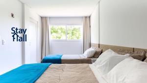 מיטה או מיטות בחדר ב-Casa de luxo, 4 Suites e Cond C Piscina-SH062