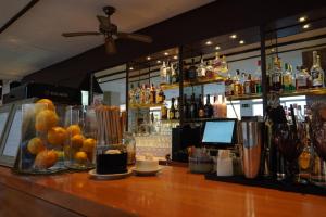 a bar with a counter with a bunch of drinks at Hotel Espanya by ALEGRIA in Calella +38 photos