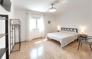 a white bedroom with a bed and a window at Gorgeous Home In Ador With Wifi in Ador +13 photos