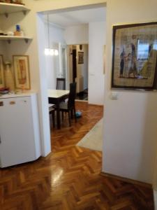 a kitchen and a dining room with a table at Appartment Center in Sarajevo