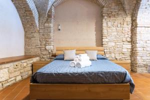 Postelja oz. postelje v sobi nastanitve Loft nel cuore di Assisi - 50 mt da Carlo Acutis