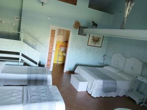 a hotel room with two beds and a staircase at Agriturismo L.B.STUD in Bracciano