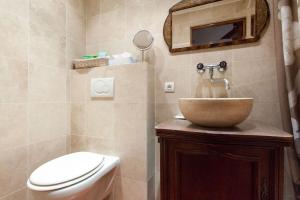 a bathroom with a sink and a toilet and a mirror at A8 - 2 BDR Duplex Remparts Heart of Old Antibes in Antibes +18 photos