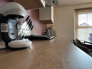 a kitchen counter with a hair dryer on top of it at Wells Nest in Wells