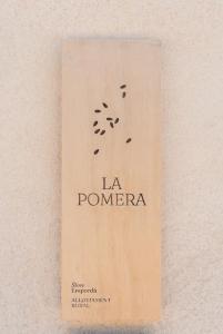 a book with the words la pomeria on the side at La Pomera in Ultramort