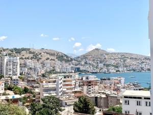 a view of a city with buildings and the water at Villa Saral Mar in Sarandë