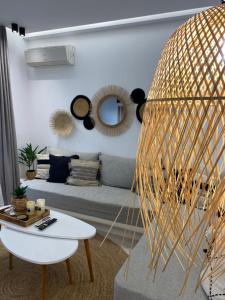 a living room with a couch and a table at Casa AMARE - Naxos in Naxos Chora