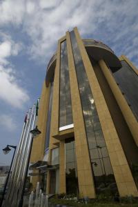 a large building with a dome on top of it at Eastyard Khobar Hotel in Al Khobar