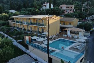 an aerial view of a hotel with a swimming pool at Passas Mare Apartments & Studios in Benitses