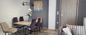 a dining room with a table and chairs at Central Park Apartment in Volos