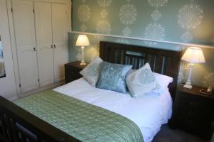Voodi või voodid majutusasutuse Roundstone House Hotel toas