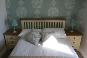 Voodi või voodid majutusasutuse Roundstone House Hotel toas