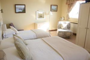Voodi või voodid majutusasutuse Roundstone House Hotel toas