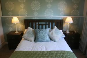 Voodi või voodid majutusasutuse Roundstone House Hotel toas