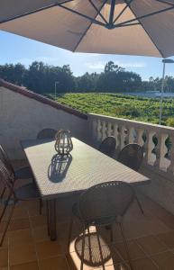 Balkón alebo terasa v ubytovaní "SANXENXO HOLIDAYS" ATICO CON GARAJE, BARBACOA y PISCINA A 5 MIN DEL CENTRO