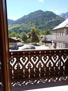 a balcony with a view of a parking lot at La Chamade in Le Biot