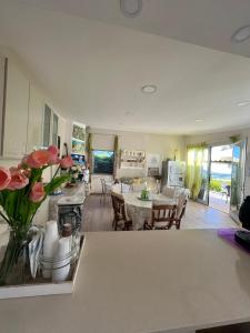 a kitchen and living room with a table and chairs at Villa Marina B&B in Cleto +98 photos