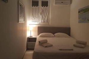 Postel nebo postele na pokoji v ubytování Mare Villa Ciel - by Portogaios Paxos Superior Living