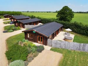 an aerial view of a house with a fence at Willow Lodge in Oakham
