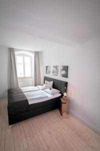 a bedroom with a bed and a window at Adam&Eva in Bamberg