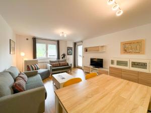 a living room with a couch and a table at Apartamento MILU en Arinsal in Arinsal