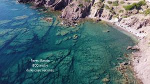 an aerial view of a beach with the ocean at Il Sole ed Il Mare Tanca Piras in Nebida