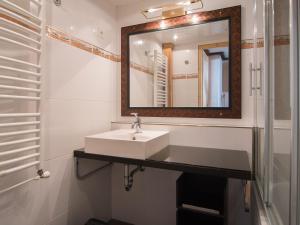 a bathroom with a sink and a mirror at Appartement Tignes, 3 pièces, 7 personnes - FR-1-449-36 in Tignes