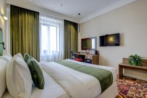 TV a/nebo společenská místnost v ubytování Garden Hotel & SPA