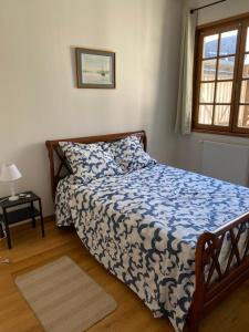 Postel nebo postele na pokoji v ubytování L’Hôtel Particulier de Lisieux