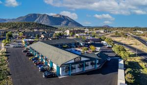 an aerial view of a building with a parking lot at Hotel Elev8 Flagstaff I-40 Exit 198 Butler Ave in Flagstaff