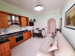 a living room with a couch and a table at Casa Simonetta Il Glicine in Ponza +11 photos