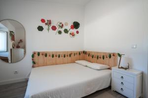 Cama ou camas em um quarto em Casa das Andorinhas