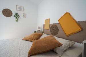 Cama ou camas em um quarto em Casa das Andorinhas