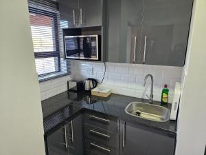 Kuchyň nebo kuchyňský kout v ubytování Intuthuzelo on Bramleigh + 32 fotografií