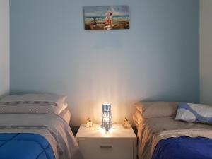 Ein Bett oder Betten in einem Zimmer der Unterkunft La Maison di Arya