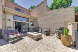 a patio with a fire pit and a grill at Ruidoso Golf Condo - Patio, Fire Pit and Mtn View! in Ruidoso