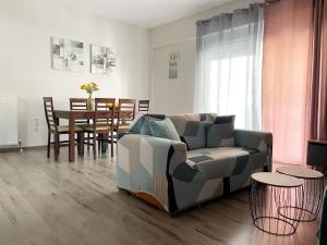 a living room with a couch and a table at Nikolas Apartment in Alexandroupoli