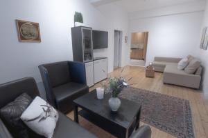 a living room with a couch and chairs and a table at Adam&Eva in Bamberg +19 photos