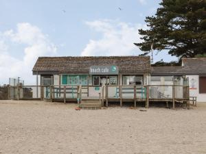 a beach club building on the beach at Dragonflies & Seahorses in Falmouth