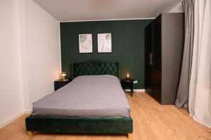 Ένα ή περισσότερα κρεβάτια σε δωμάτιο στο Cotroceni Accommodations