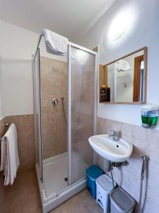 a bathroom with a shower and a sink at B&B Villa Susanna in Civitavecchia