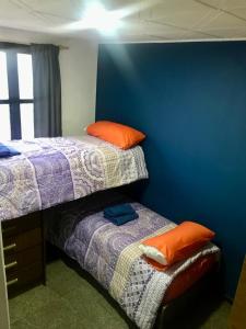 Postel nebo postele na pokoji v ubytování Casa con cochera. Amanecer mendocino