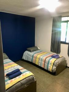 Postel nebo postele na pokoji v ubytování Casa con cochera. Amanecer mendocino