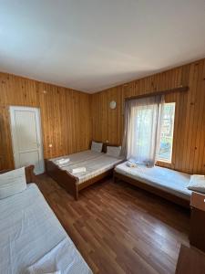 a room with two beds and a window at EVRIKA hotel Shekvetili in Shekvetili