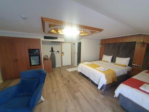 Ένα ή περισσότερα κρεβάτια σε δωμάτιο στο Dimora Gold Hotel
