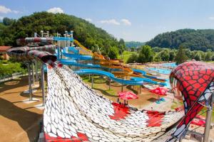 a large water park with a water slide at Aqualuna Olimia Vacation Home in Podčetrtek