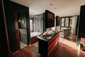 a bathroom with a sink and a bath tub at Casa Grande Do Bachao in Santiago de Compostela