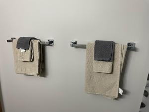 two towels hanging on a towel rack in a bathroom at One Bedroom Main floor Apartment in Camrose