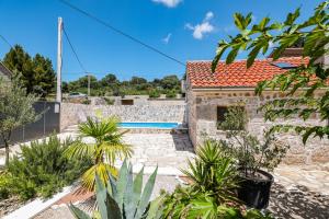 a view of a house with a swimming pool at Holiday house Manuela in Kruševo