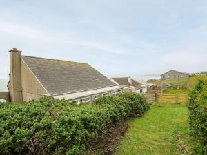 a building with a roof on top of a field at Westcroft 6 Withnoe Terrace in Torpoint